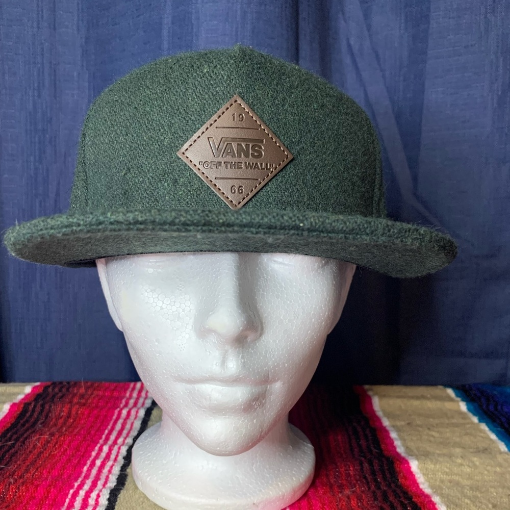 Dark green Vans snap back hat.